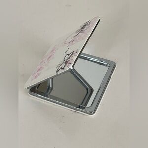 Sleek Silver and Pink Tablet Accessory with Reflective Interior